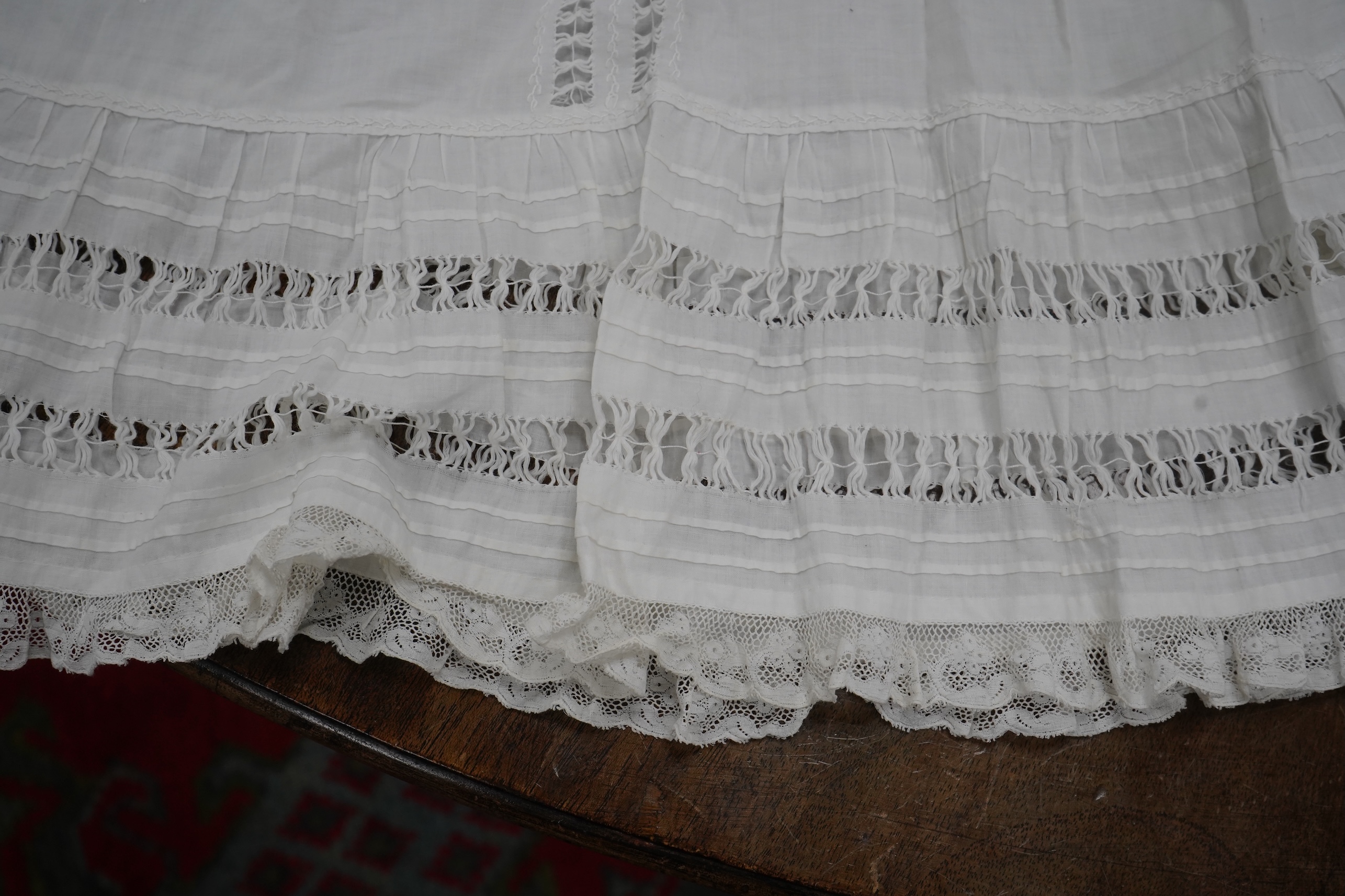 Five Victorian white worked fine cotton and lawn baby’s christening gowns. mostly worked with embroidery anglaise, feather stitching, tucking, drawn thread work and lace edging, longest 41cm. Condition - in good conditio